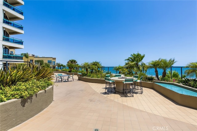 view of patio featuring a water view