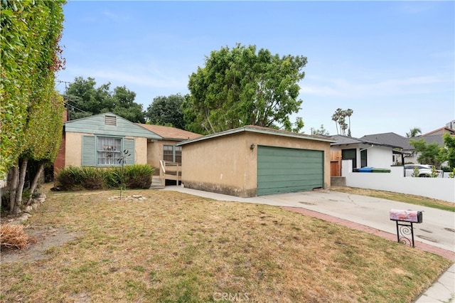 single story home featuring a front yard and a garage