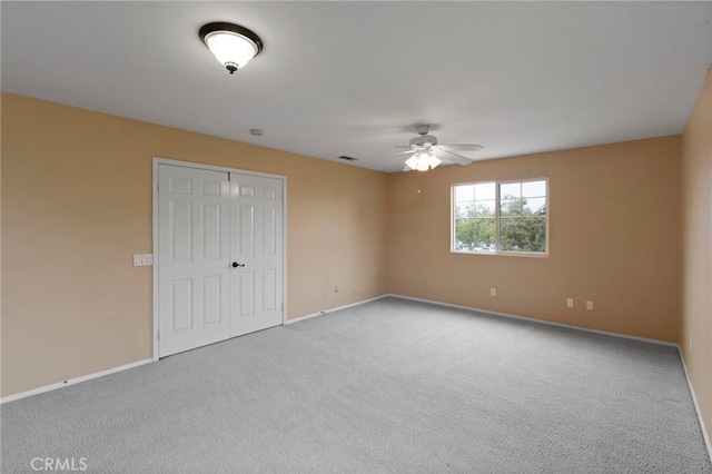 interior space with ceiling fan