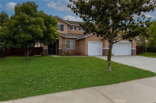 view of front of home featuring a garage and a front lawn