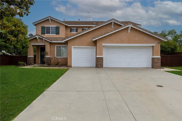 view of front facade featuring a front yard and a garage