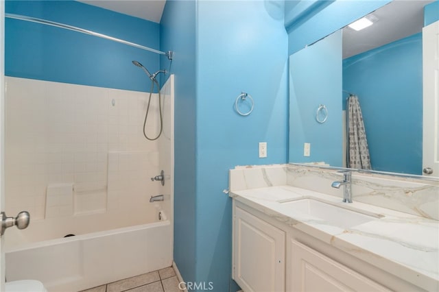 full bathroom featuring tile floors, oversized vanity, toilet, and shower / tub combo