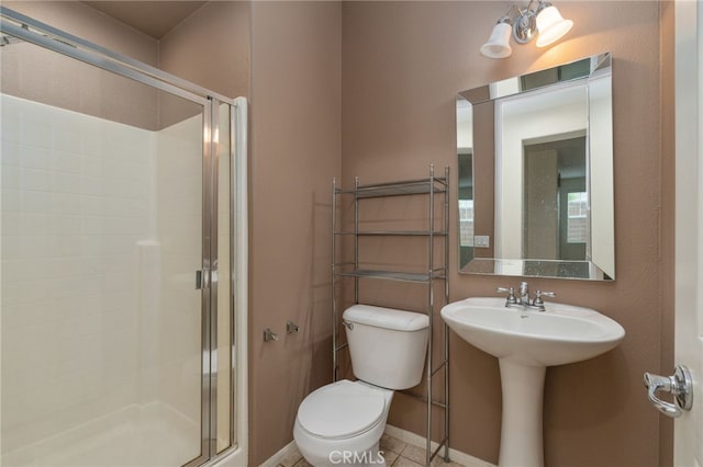 bathroom with walk in shower, tile flooring, and toilet