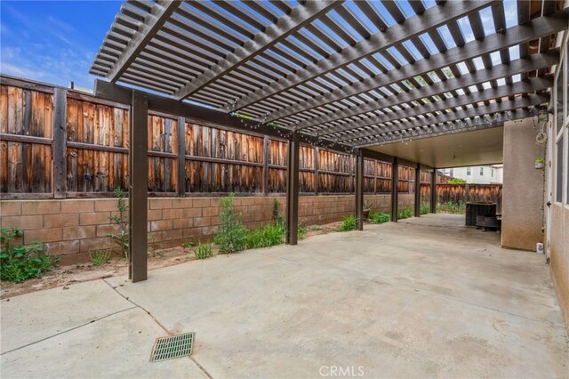 view of patio featuring a pergola and central AC unit