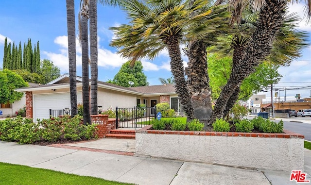 view of front of home with a garage