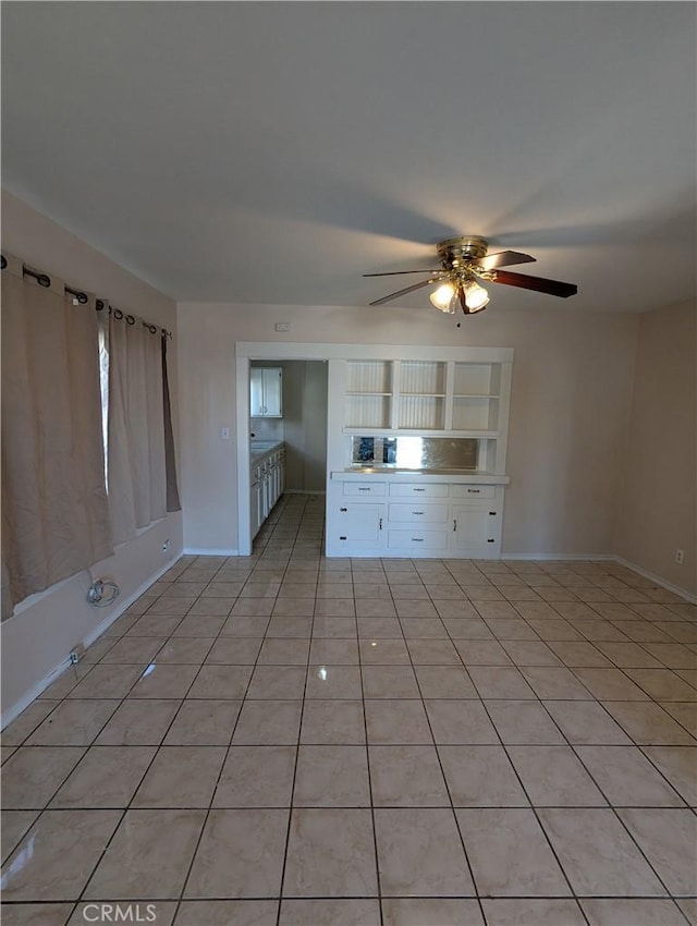 interior space with ceiling fan