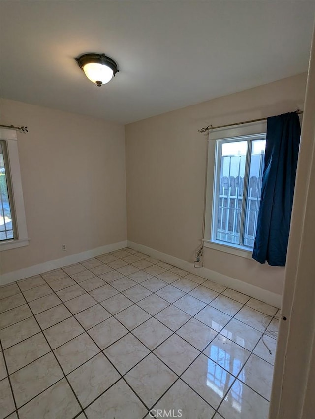 view of tiled spare room