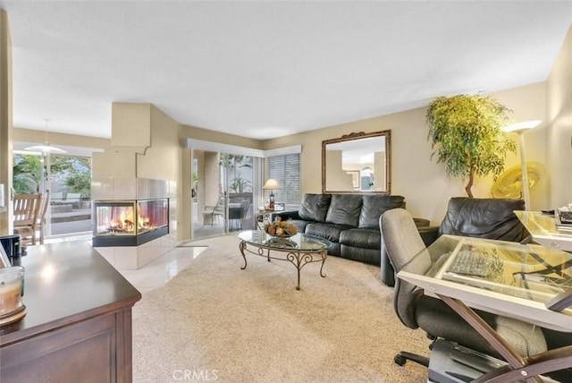 living room with a wealth of natural light and a tiled fireplace