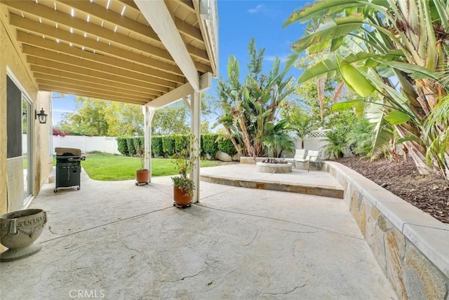 view of patio featuring grilling area and a fire pit