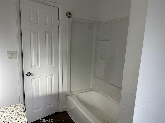 bathroom with hardwood / wood-style floors