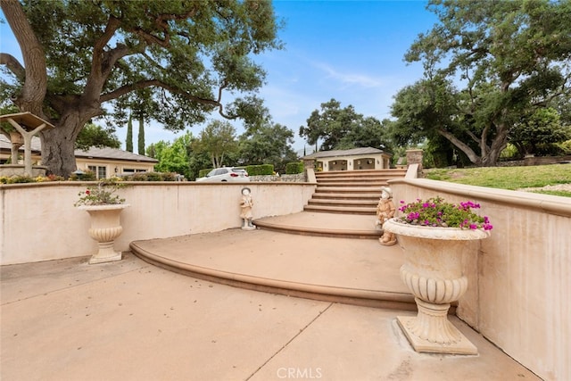 view of home's community featuring a patio area