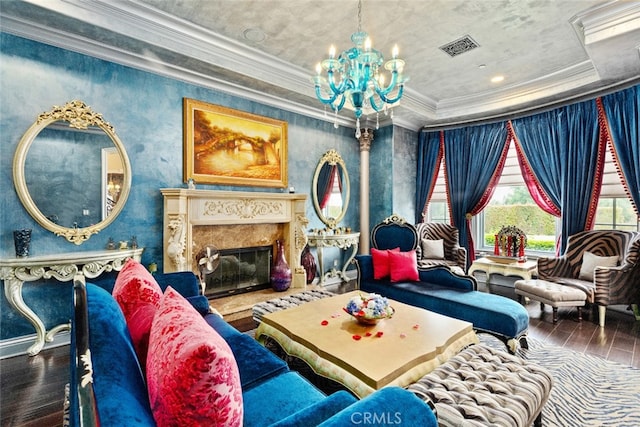 sitting room with crown molding, a notable chandelier, a premium fireplace, and hardwood / wood-style floors