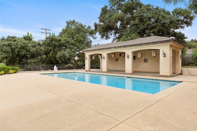 view of swimming pool featuring a patio area