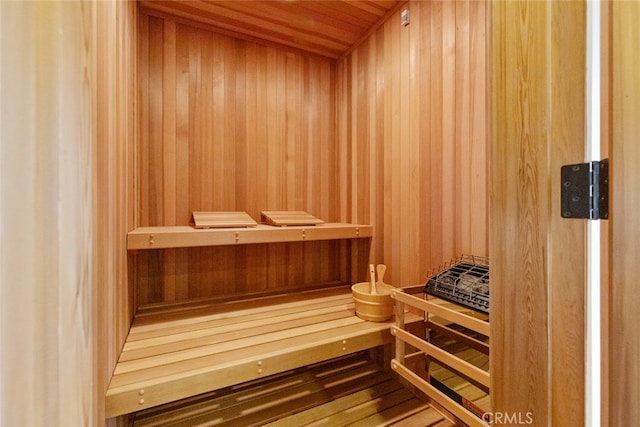 view of sauna / steam room with wood walls and wooden ceiling