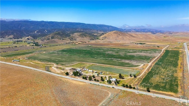 drone / aerial view featuring a mountain view and a rural view