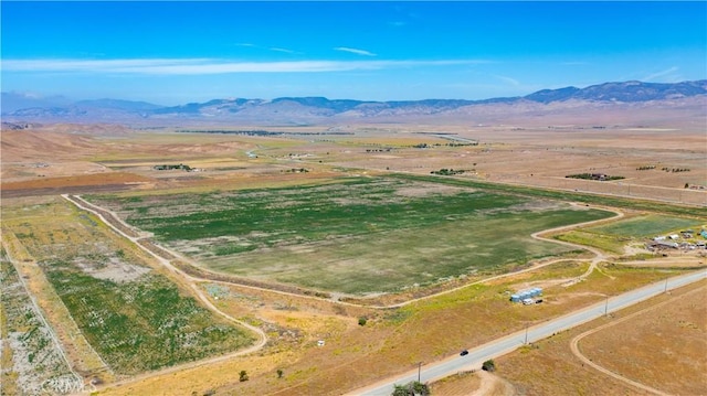 drone / aerial view featuring a mountain view and a rural view