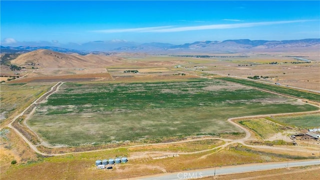 drone / aerial view with a mountain view and a rural view