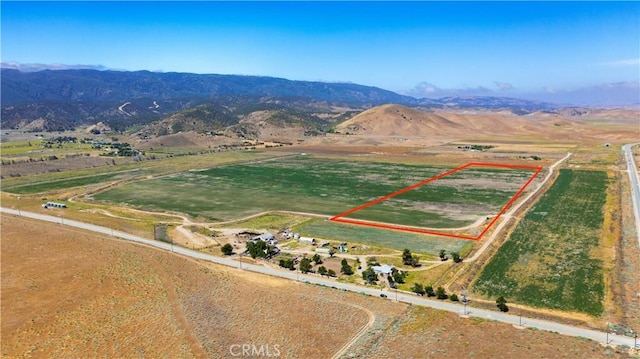 birds eye view of property with a mountain view and a rural view