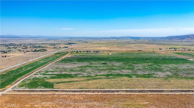 aerial view with a mountain view and a rural view