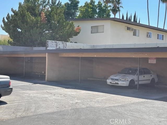 view of parking with a carport