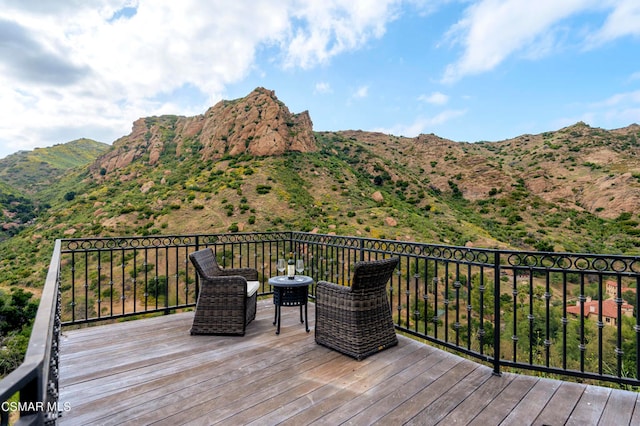 wooden terrace with a mountain view