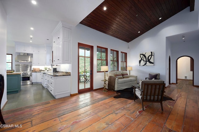 living room featuring wood ceiling, high vaulted ceiling, and dark hardwood / wood-style flooring