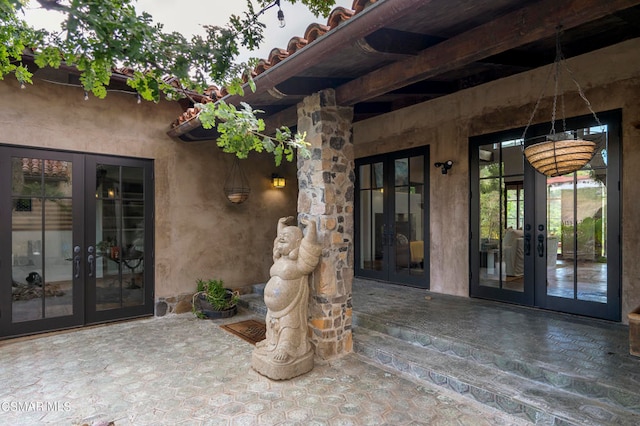 doorway to property featuring french doors and a patio area