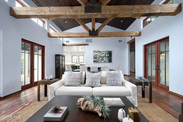 living room featuring french doors, a wealth of natural light, and hardwood / wood-style floors