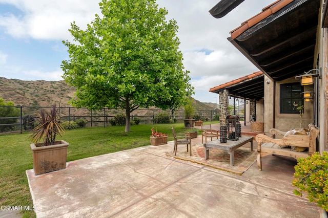 view of patio / terrace featuring a mountain view