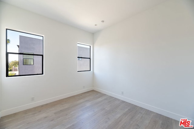 unfurnished room featuring light hardwood / wood-style floors