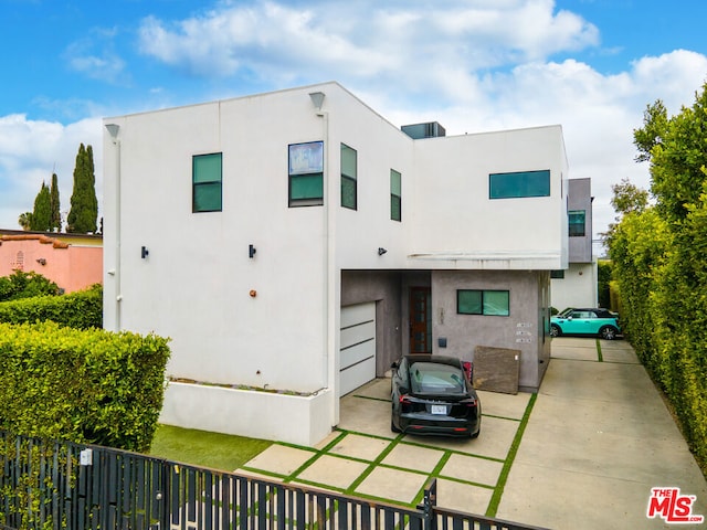 view of front of house with a carport and a garage