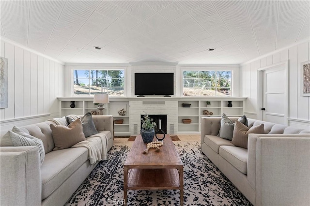 3210 Live Oak Park Rd, Fallbrook, CA 92028 - living area with crown molding and a fireplace with flush hearth