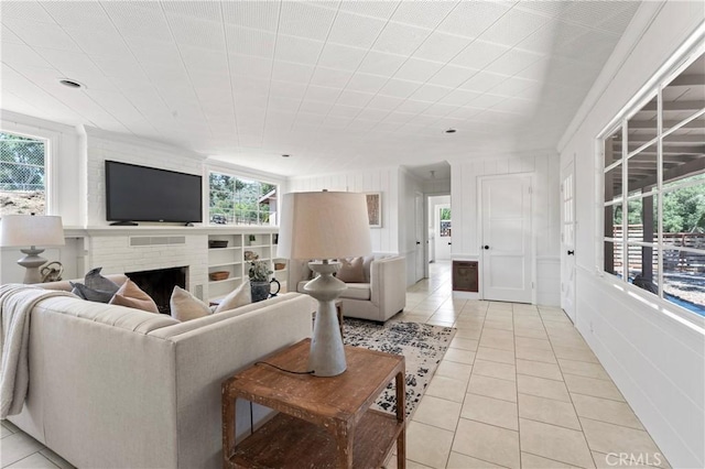 3210 Live Oak Park Rd, Fallbrook, CA 92028 - living area with light tile patterned flooring, healthy amount of natural light, and a brick fireplace