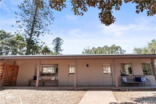 3210 Live Oak Park Rd, Fallbrook, CA 92028 - rear view of house with a porch and stucco siding