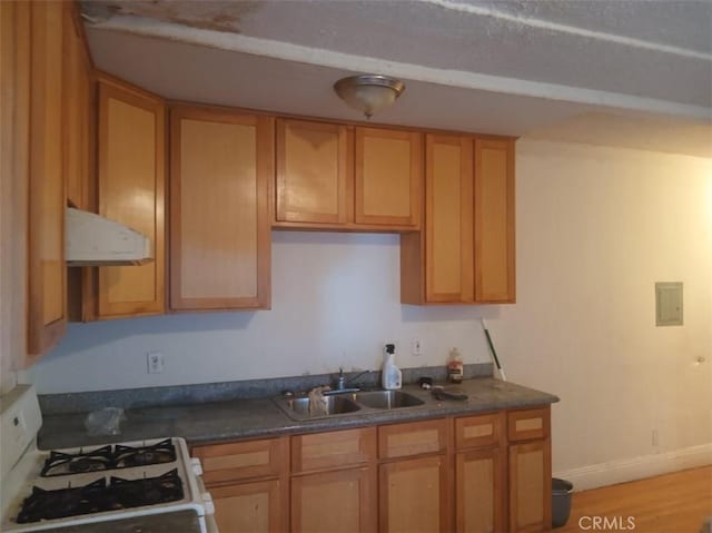 2123 High St, Oakland, CA 94601 - kitchen with gas range gas stove, a sink, dark countertops, and ventilation hood