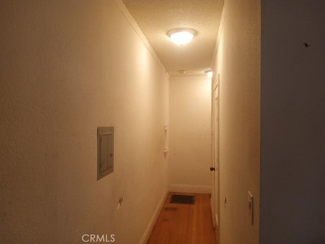 2123 High St, Oakland, CA 94601 - corridor with a textured ceiling, baseboards, and wood finished floors
