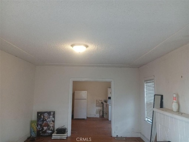 2123 High St, Oakland, CA 94601 - unfurnished room featuring a textured ceiling and wood finished floors