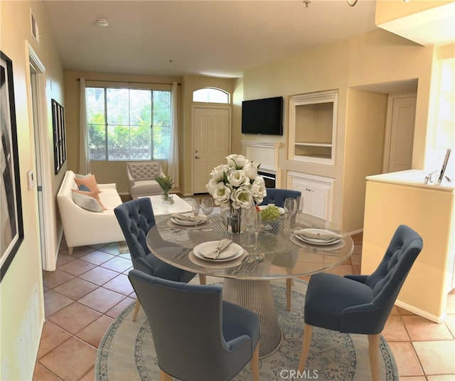 dining space featuring light tile patterned floors