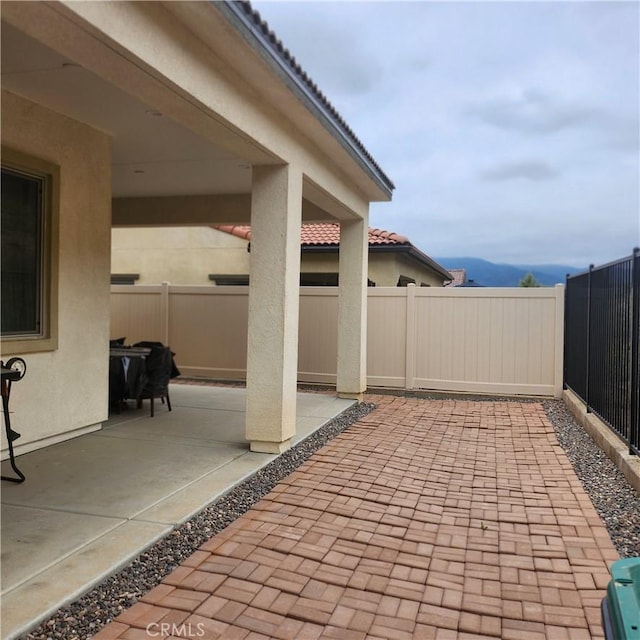 view of patio / terrace featuring a mountain view