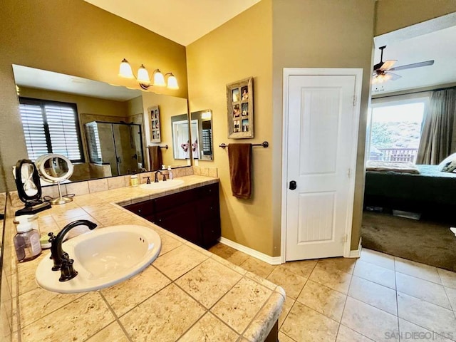 bathroom featuring vanity, ceiling fan, tile patterned flooring, and walk in shower