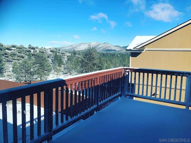 wooden terrace featuring a mountain view