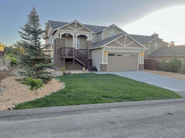 view of front of property with a porch, a front lawn, and a garage