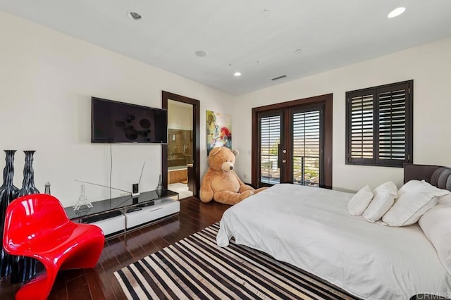 bedroom with connected bathroom, dark wood-type flooring, french doors, and access to exterior