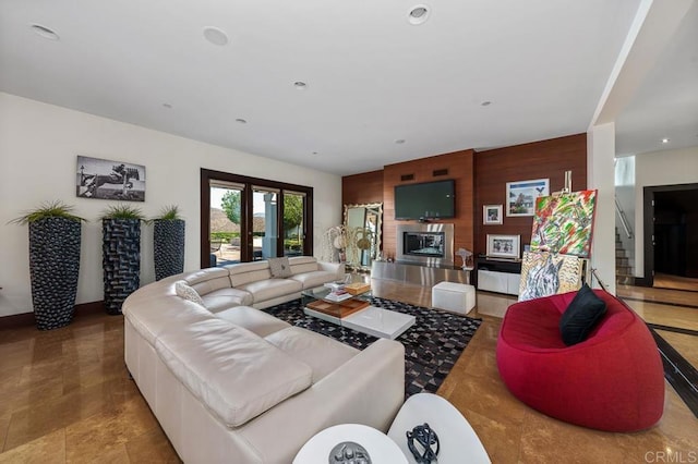 living room with wooden walls and french doors