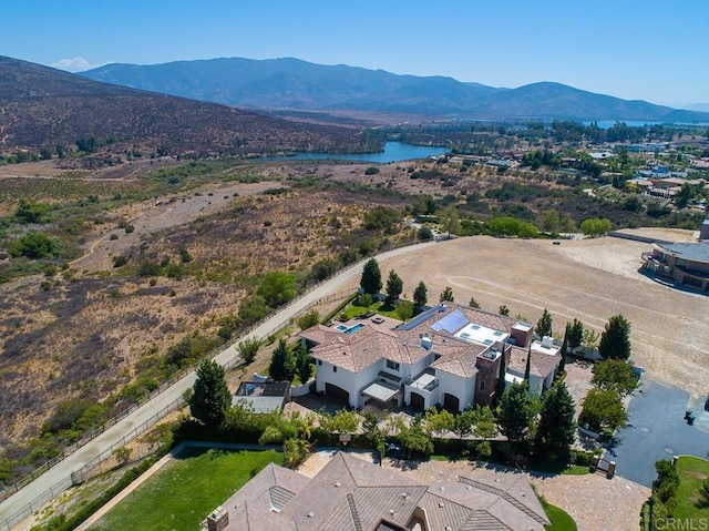 aerial view featuring a water and mountain view