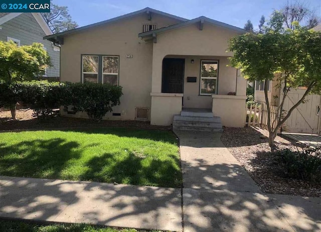 view of front of property with a front lawn