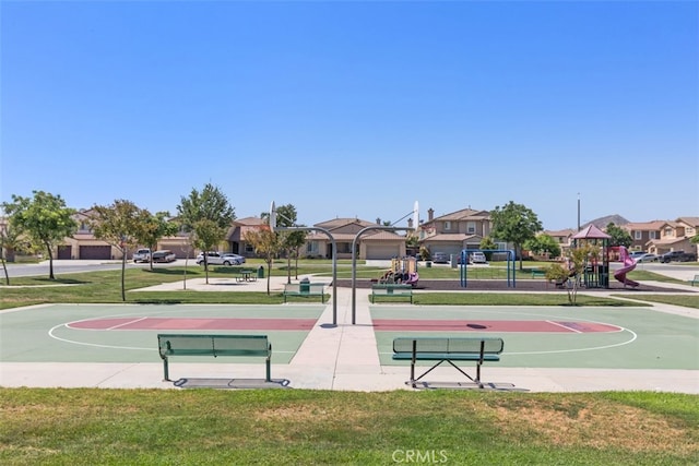 view of sport court featuring a yard and a playground