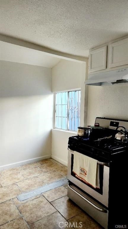 kitchen with white cabinetry, stainless steel range with gas cooktop, and a textured ceiling