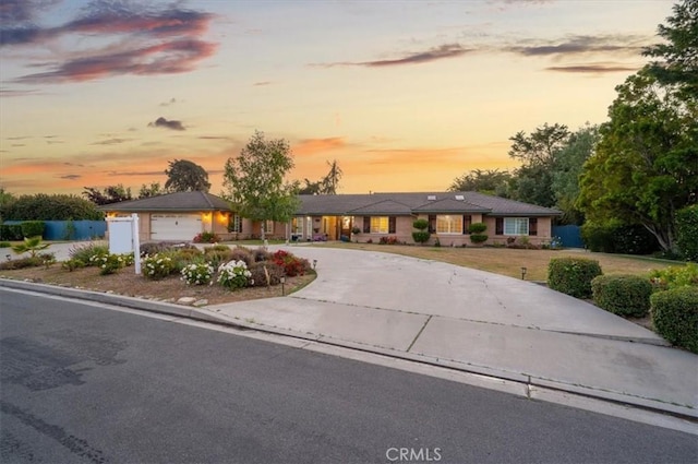 ranch-style house featuring a garage