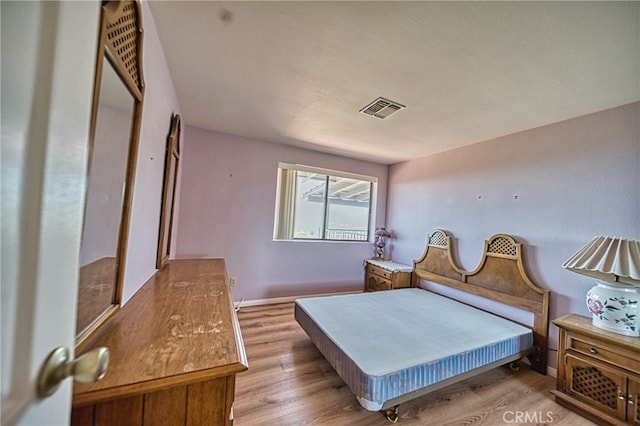 bedroom featuring light wood-type flooring